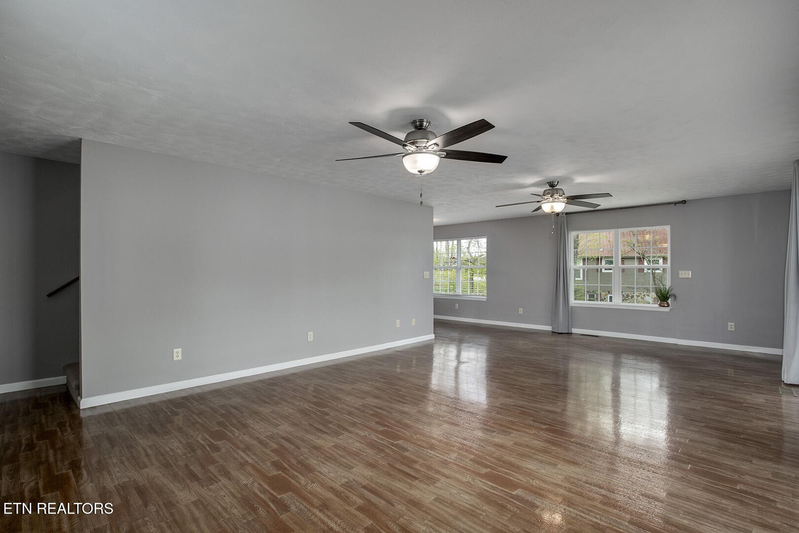 609 Lakewood Drive Decatur, TN 37322 - Photo 20 of 60 a view of an empty room with wooden floor and a window