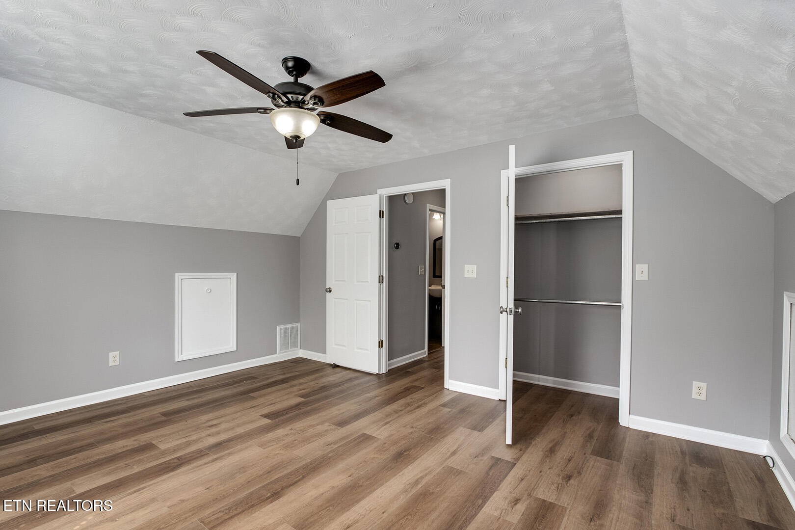 609 Lakewood Drive Decatur, TN 37322 - Photo 24 of 60 a view of empty room with wooden floor and ceiling fan
