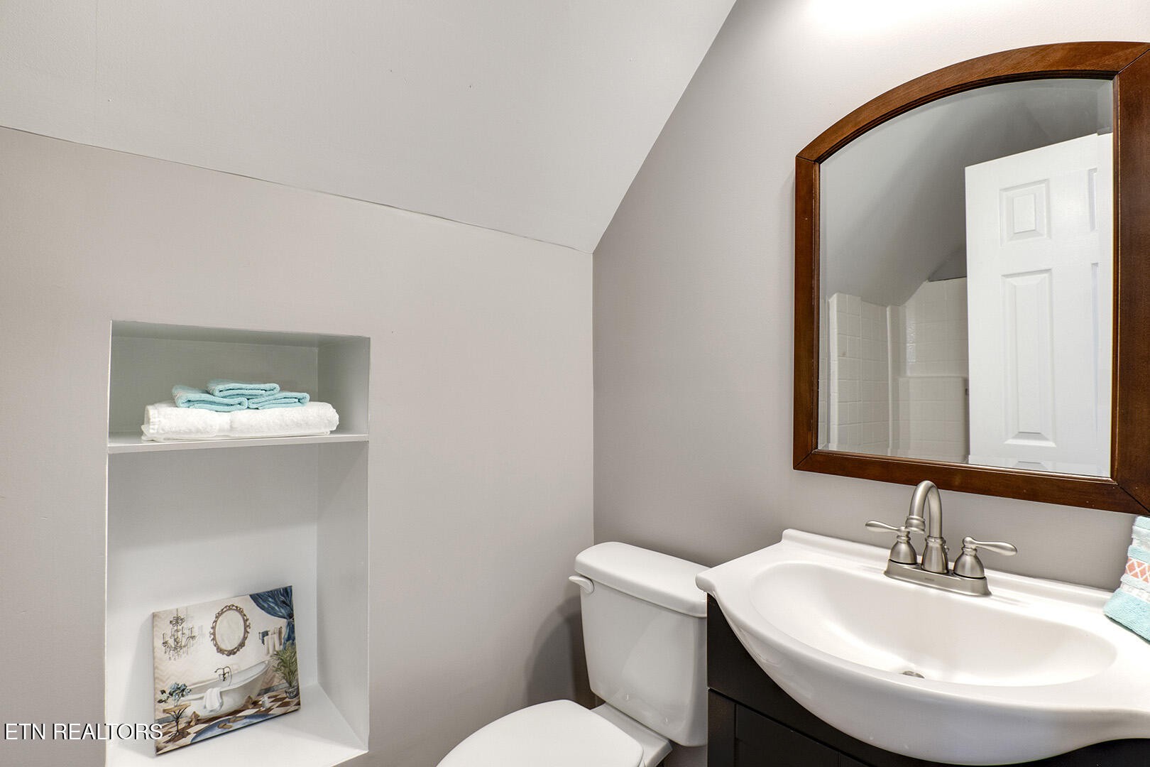 609 Lakewood Drive Decatur, TN 37322 - Photo 26 of 60 a bathroom with a toilet a sink and mirror