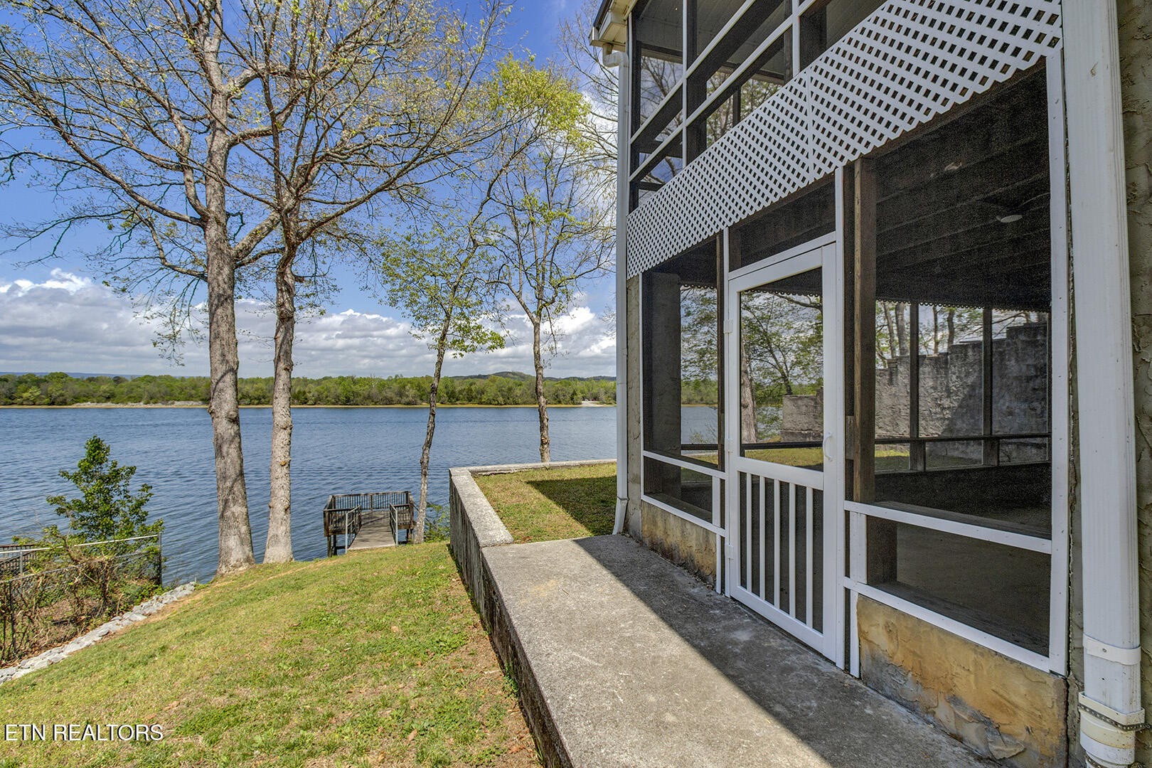 609 Lakewood Drive Decatur, TN 37322 - Photo 39 of 60 a view of a house with a porch and a yard