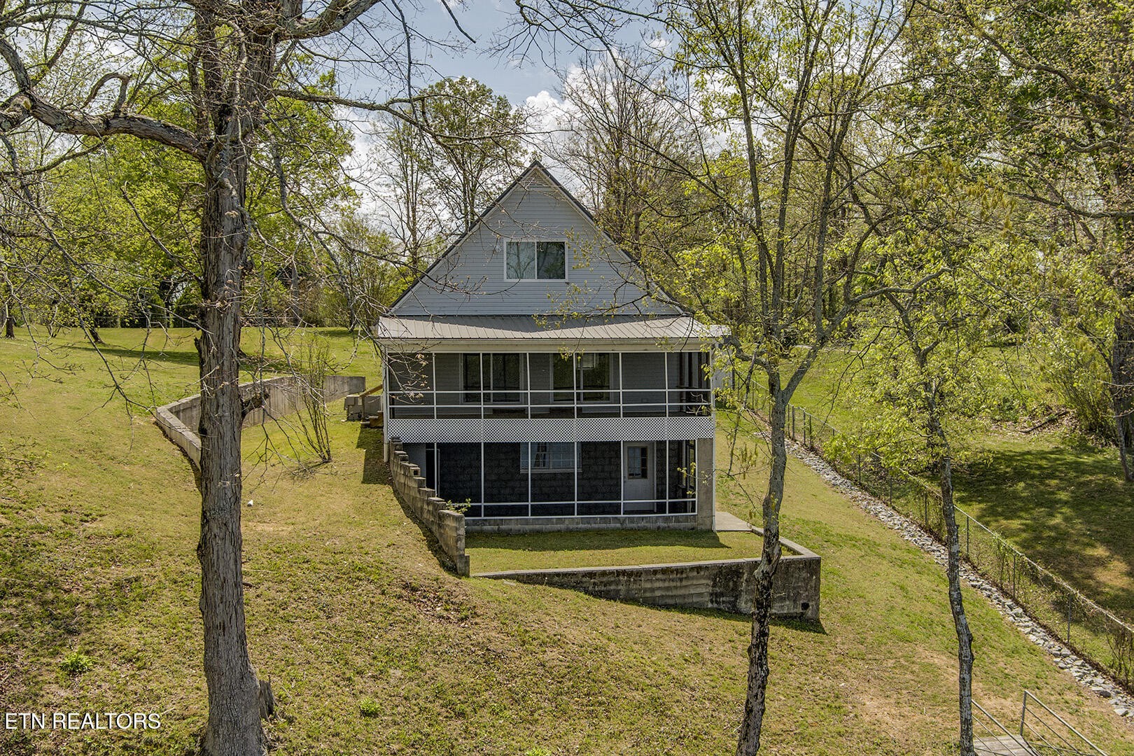 609 Lakewood Drive Decatur, TN 37322 - Photo 43 of 60 a front view of a house with a yard