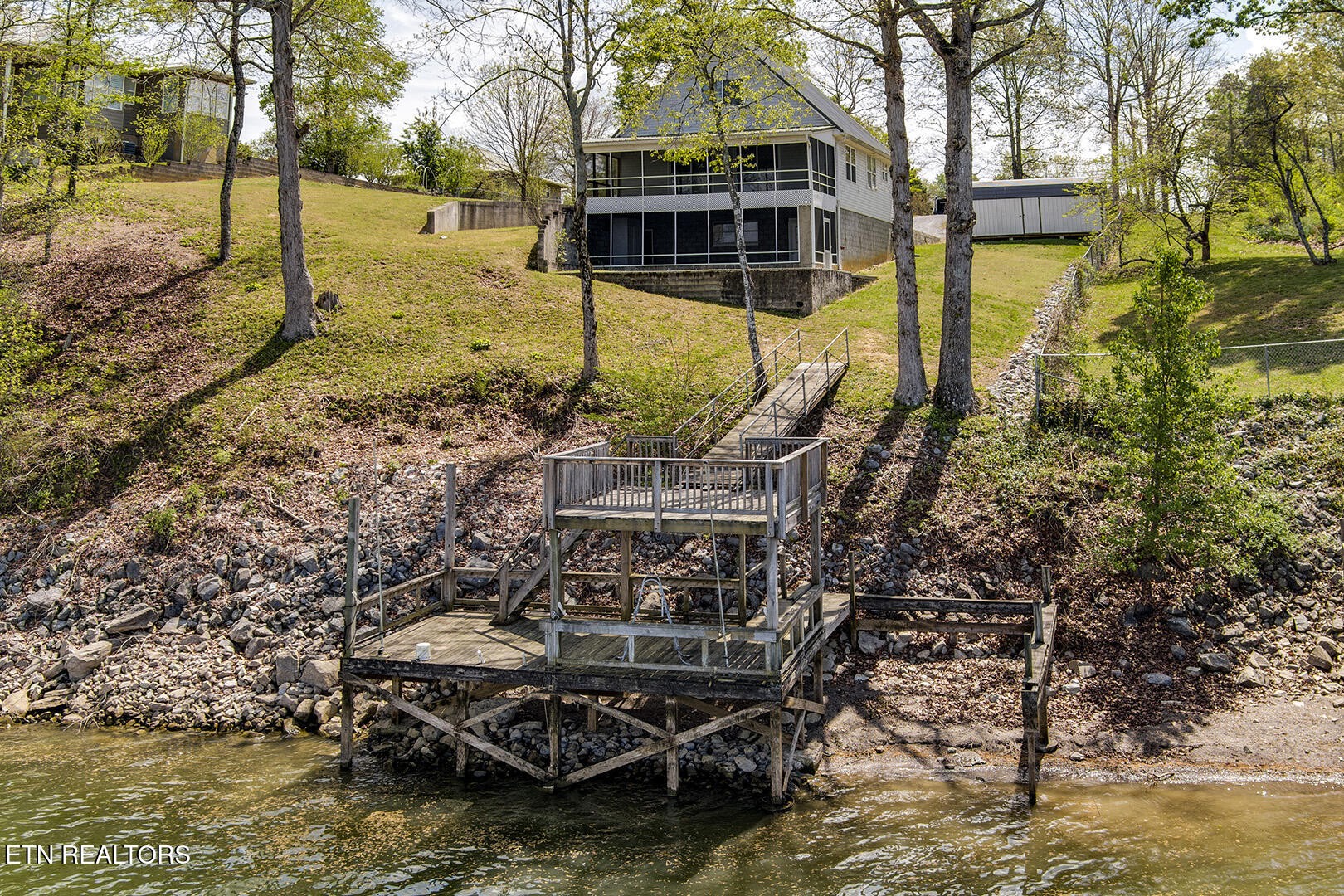 609 Lakewood Drive Decatur, TN 37322 - Photo 51 of 60 a view of a lake with a house in the background