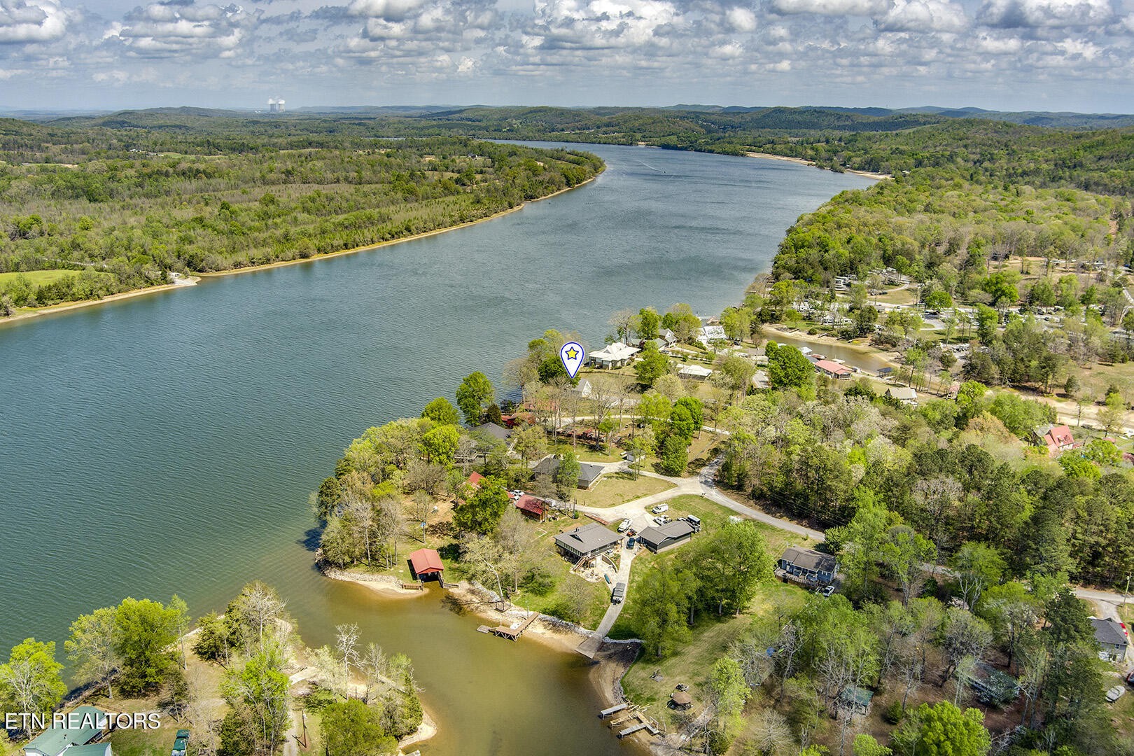609 Lakewood Drive Decatur, TN 37322 - Photo 58 of 60 a view of a lake with a beach