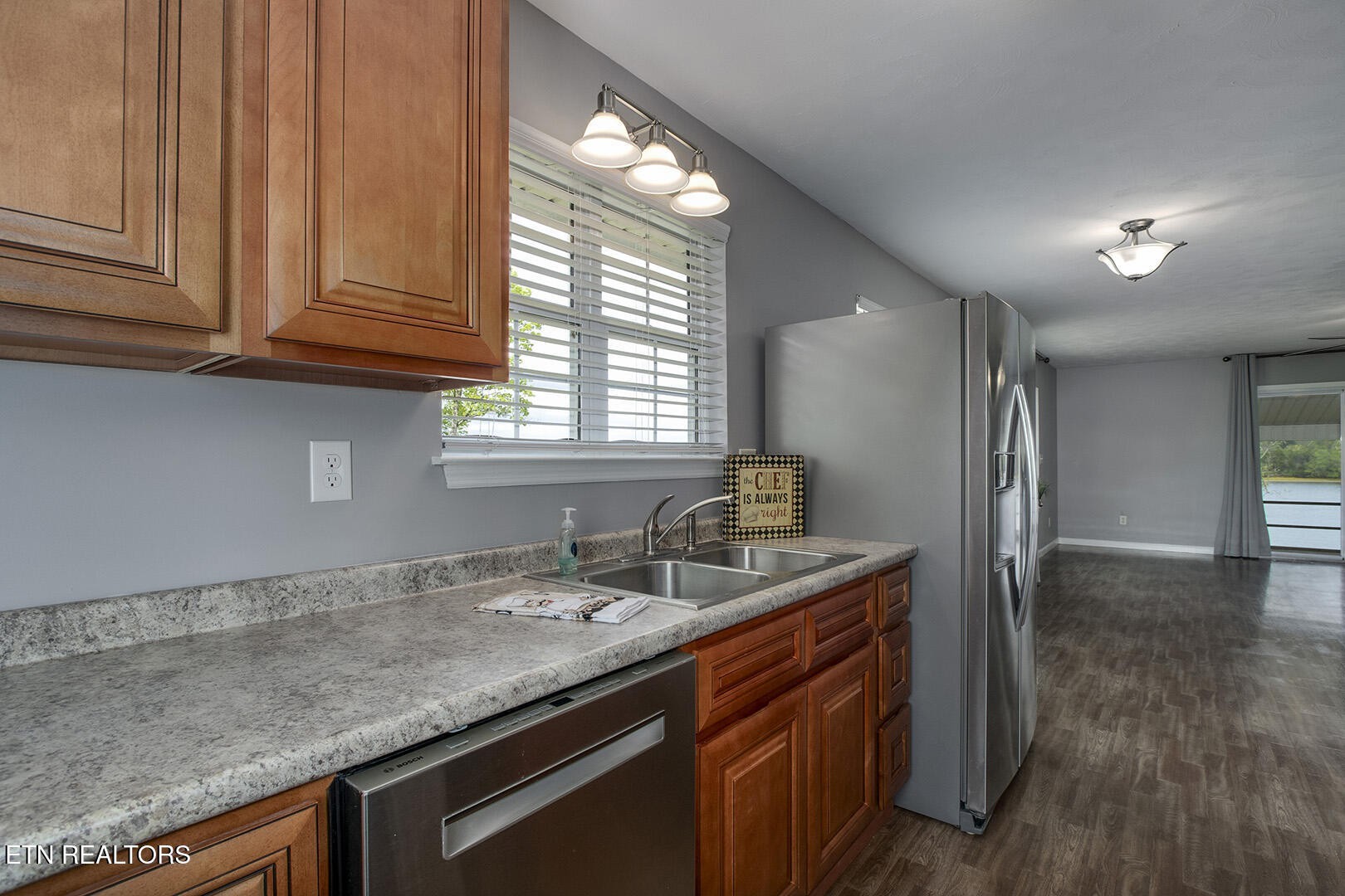 609 Lakewood Drive Decatur, TN 37322 - Photo 6 of 60 a kitchen with granite countertop stainless steel appliances a sink and cabinets