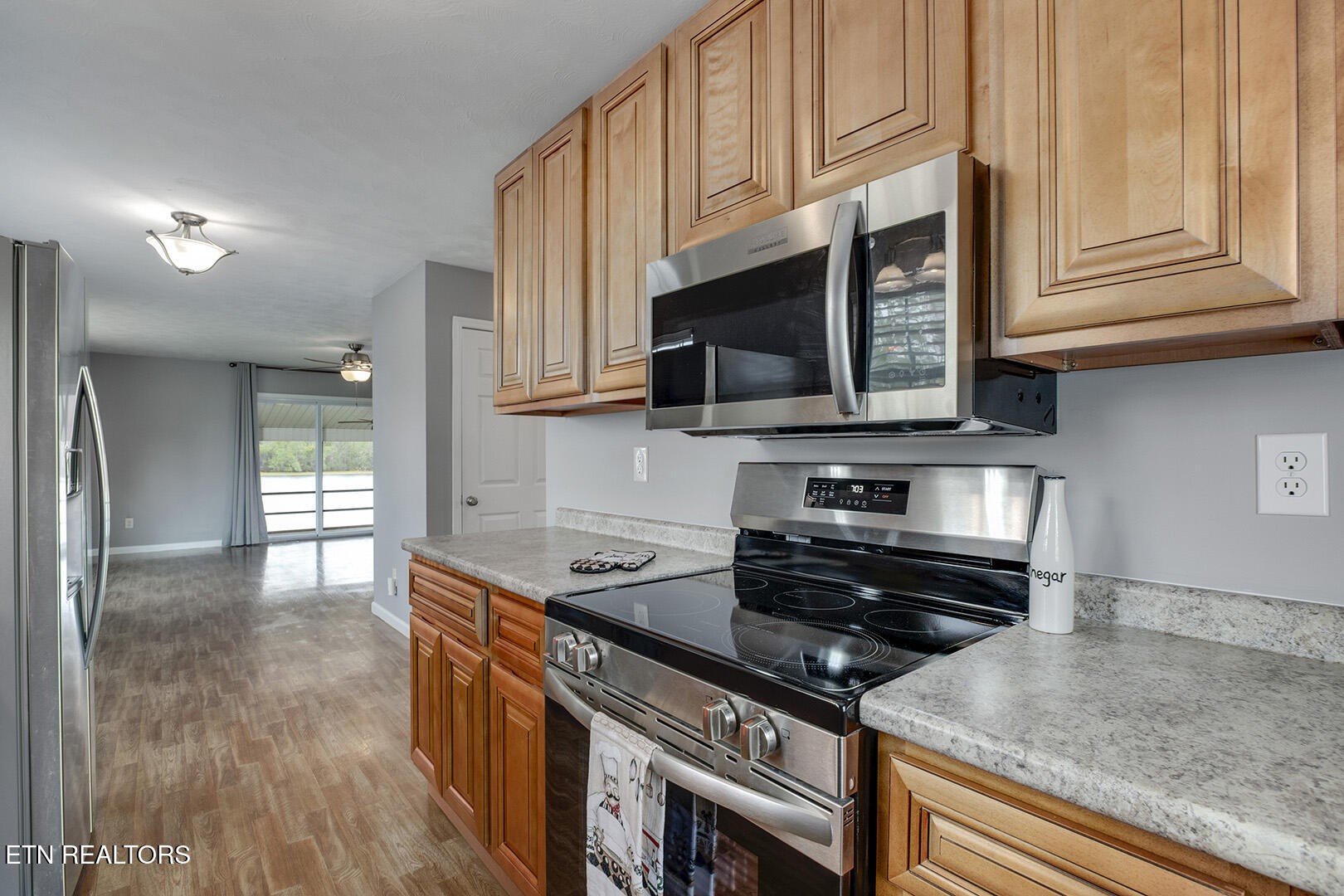609 Lakewood Drive Decatur, TN 37322 - Photo 8 of 60 a kitchen with stainless steel appliances granite countertop a stove and a microwave
