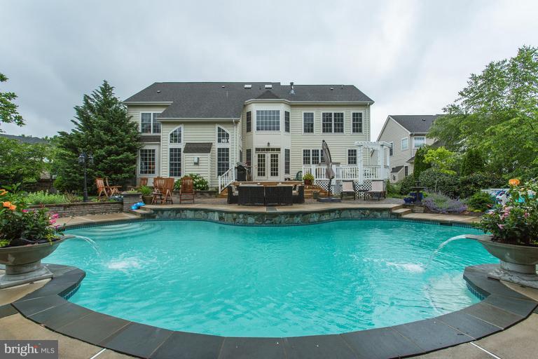 9070 Roaring Spring Loop Bristow, VA 20136 - Photo 1 of 30 You want to jump in this POOL!
