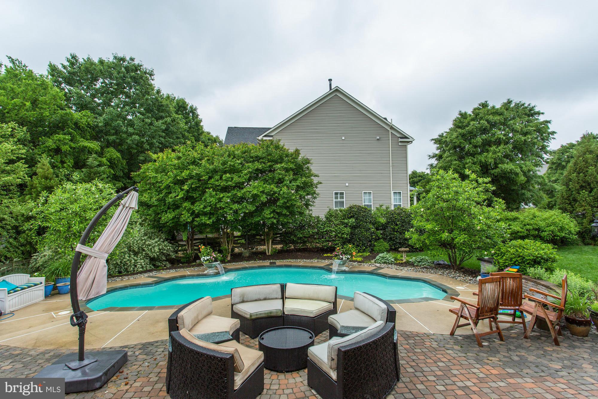 9070 Roaring Spring Loop Bristow, VA 20136 - Photo 29 of 30 Crystal clear blue pool for those hot summers