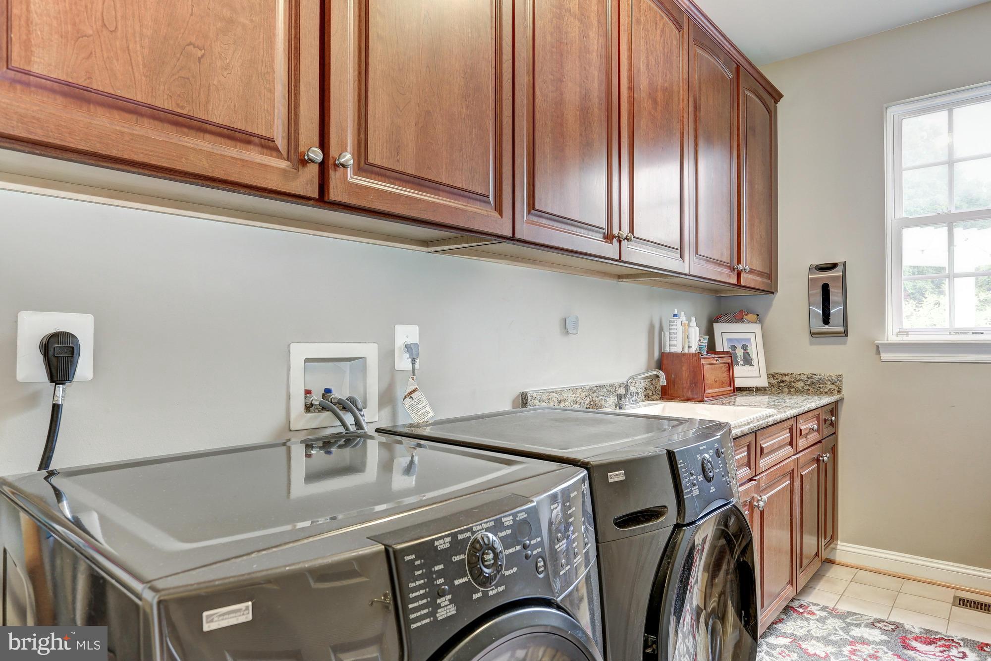 9070 Roaring Spring Loop Bristow, VA 20136 - Photo 8 of 30 Laundry room with cupboard space