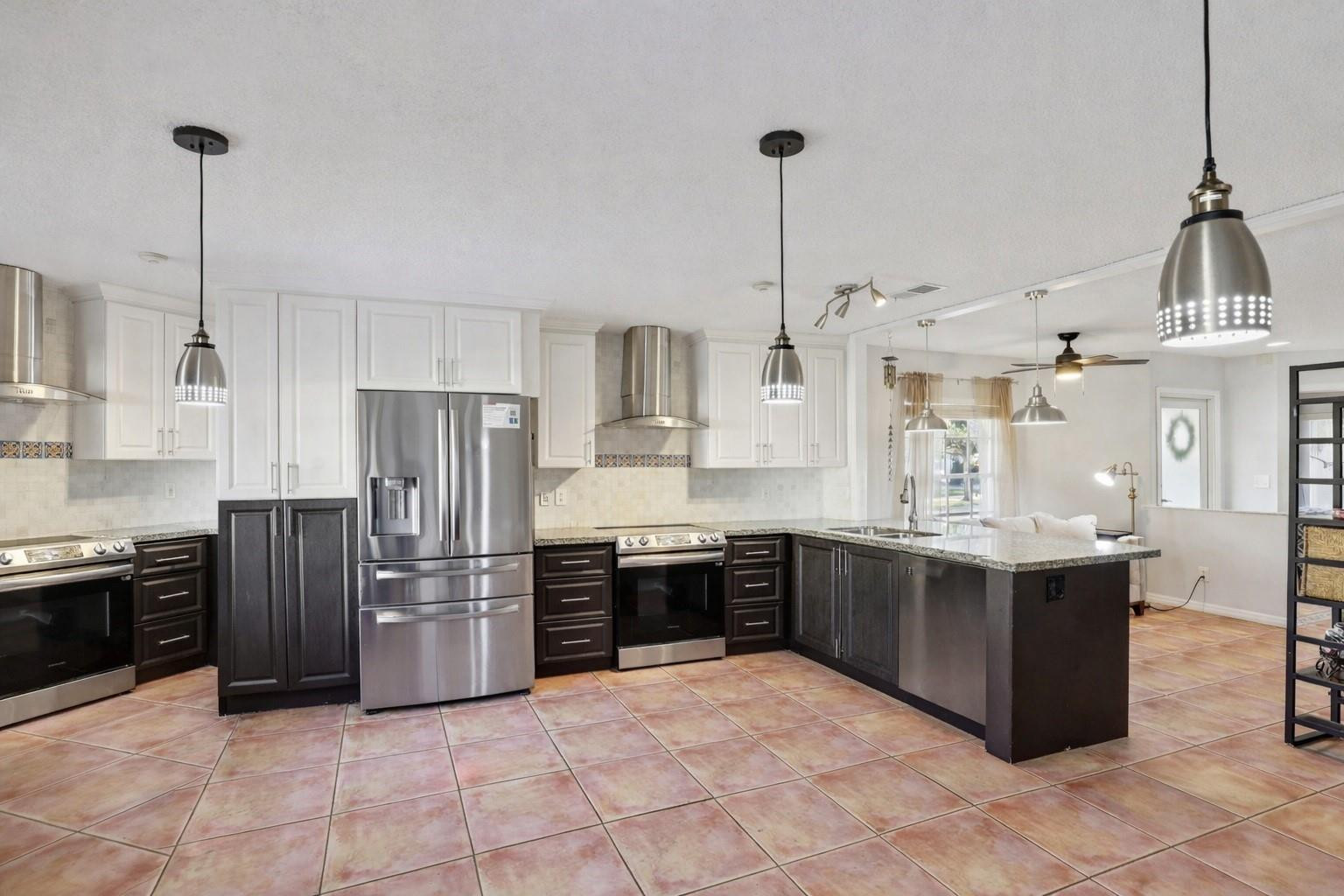 972 Azure Lane Weston, FL 33326 - Photo 17 of 61 truly serves as the heart of the home.
