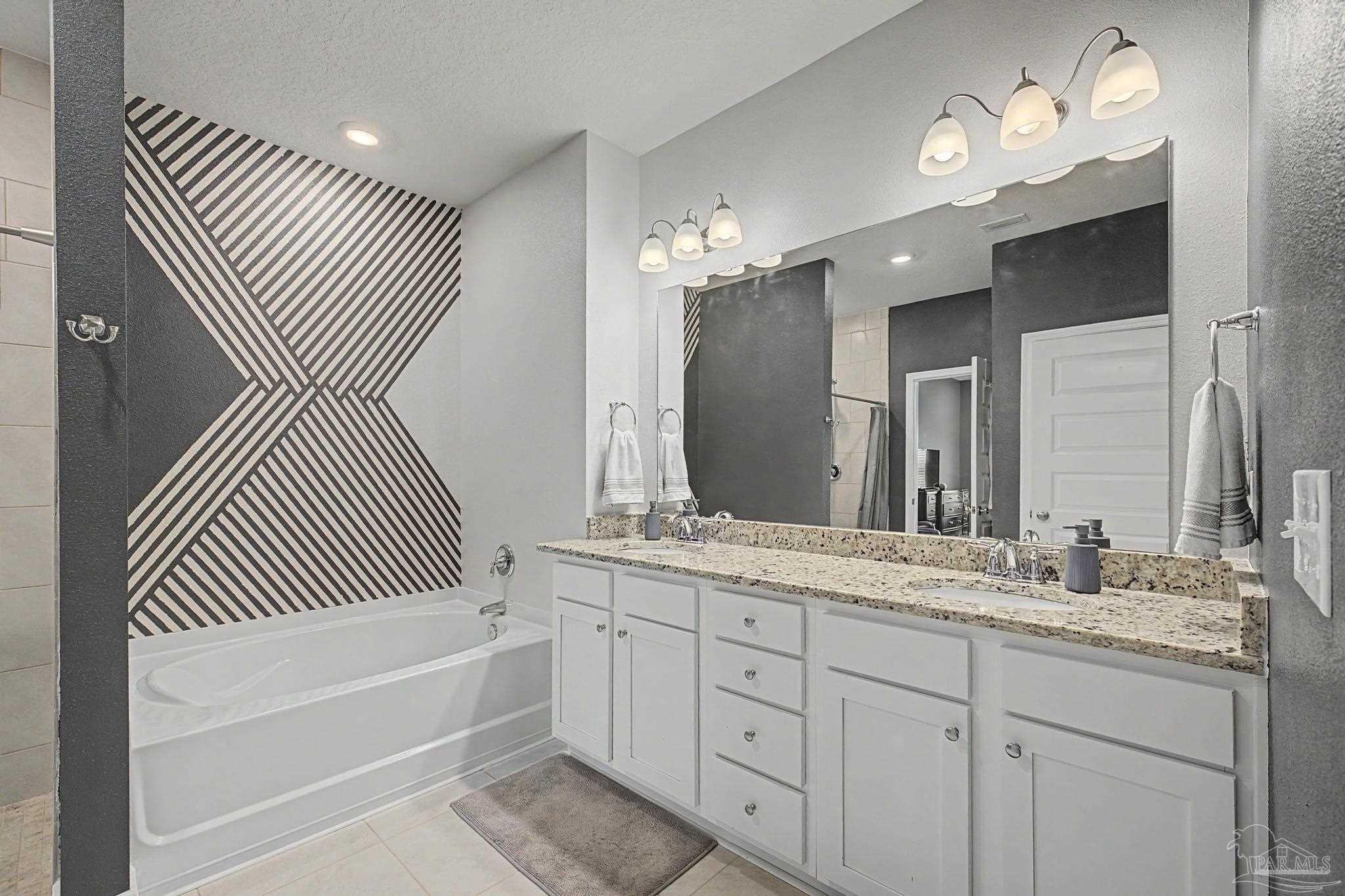 7902 Burnside Loop Pensacola, FL 32526 - Photo 18 of 47 a bathroom with a double vanity sink double and mirror