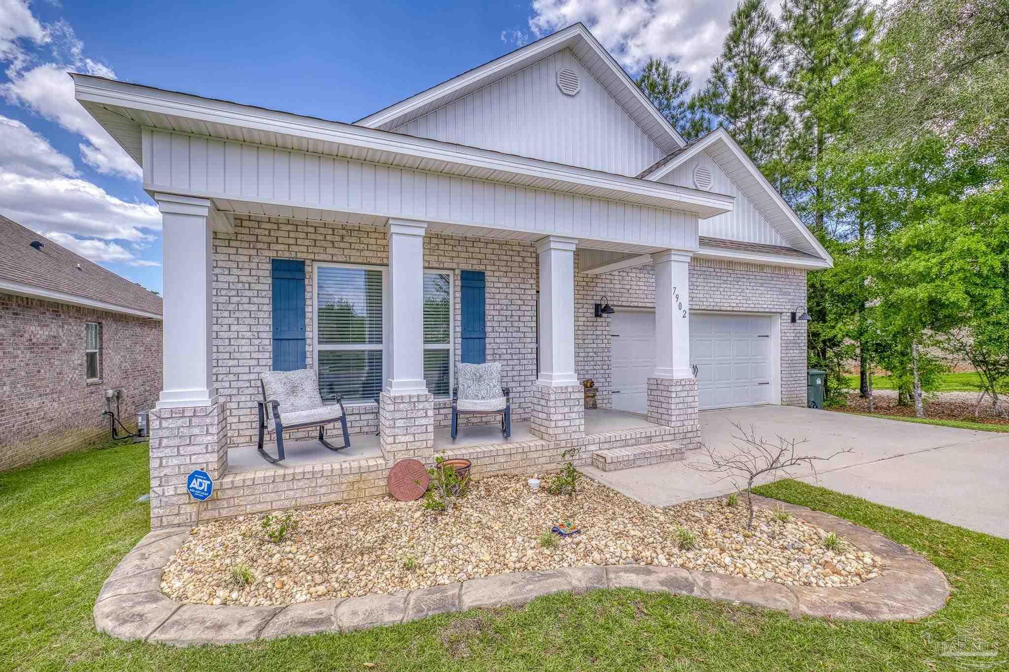 7902 Burnside Loop Pensacola, FL 32526 - Photo 2 of 47 a view of a house with backyard porch and sitting area