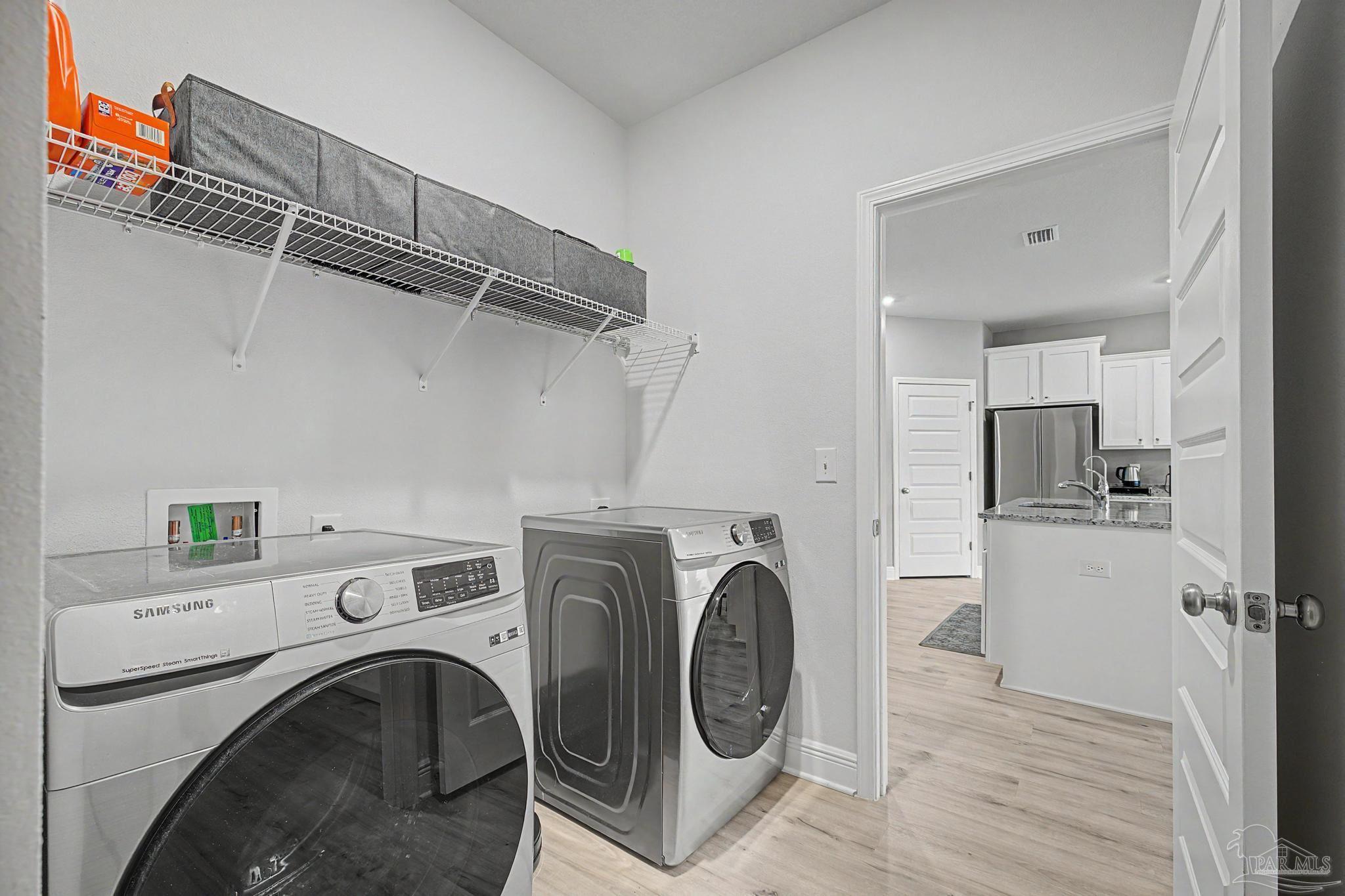 7902 Burnside Loop Pensacola, FL 32526 - Photo 22 of 47 a view of kitchen with washer and dryer