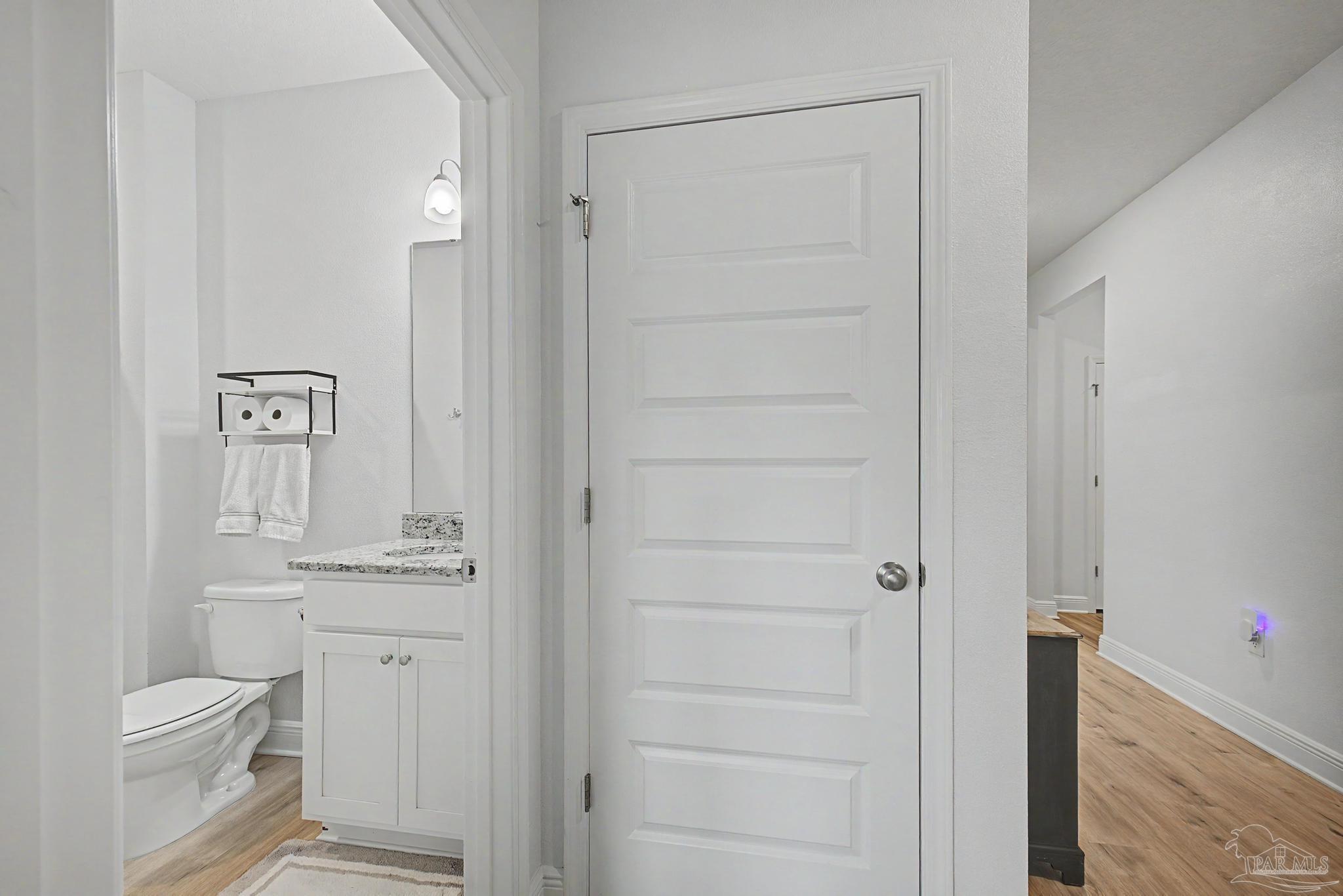 7902 Burnside Loop Pensacola, FL 32526 - Photo 26 of 47 a bathroom with a toilet a sink and shower