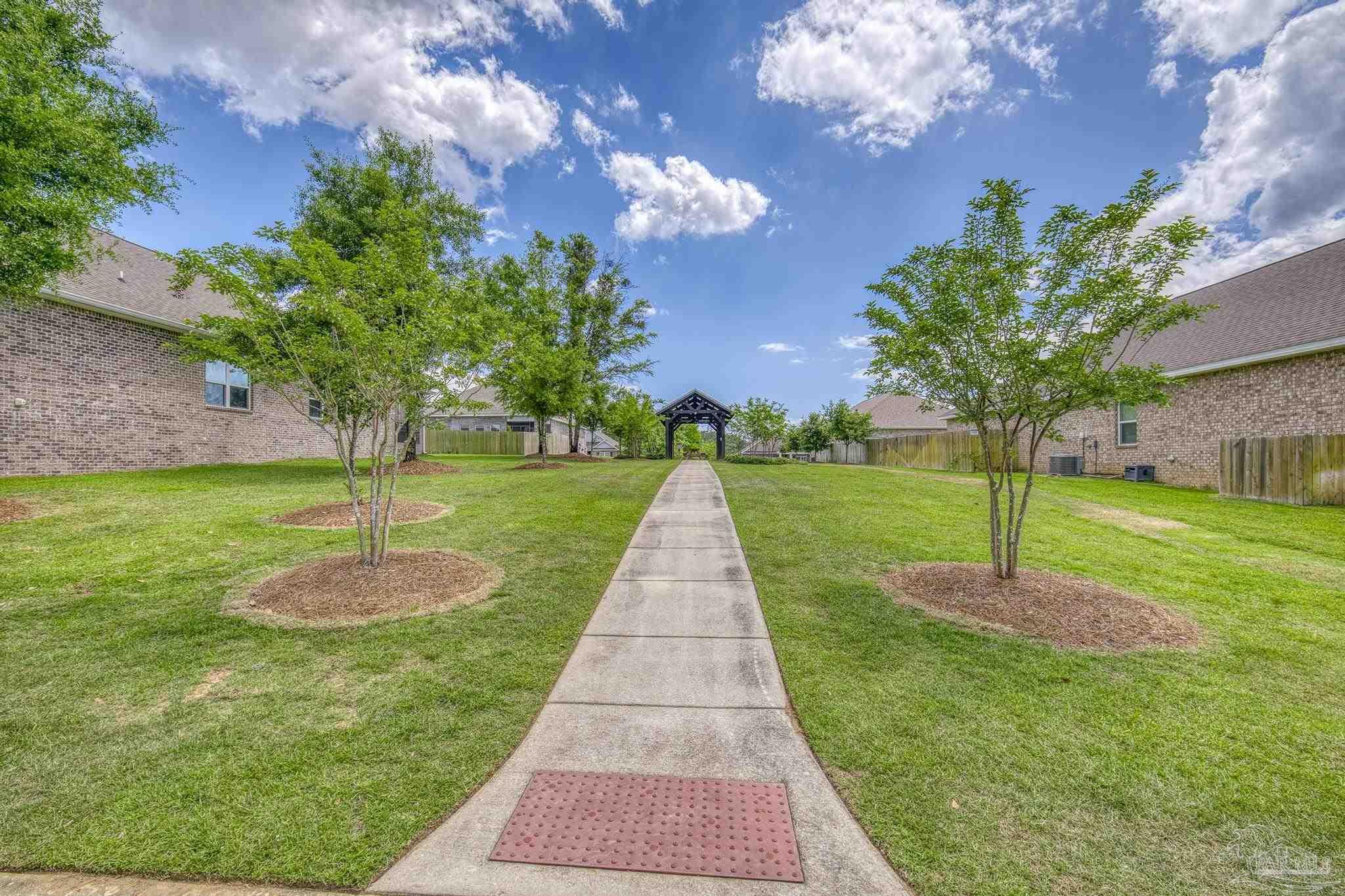 7902 Burnside Loop Pensacola, FL 32526 - Photo 44 of 47 a view of a garden with a fountain