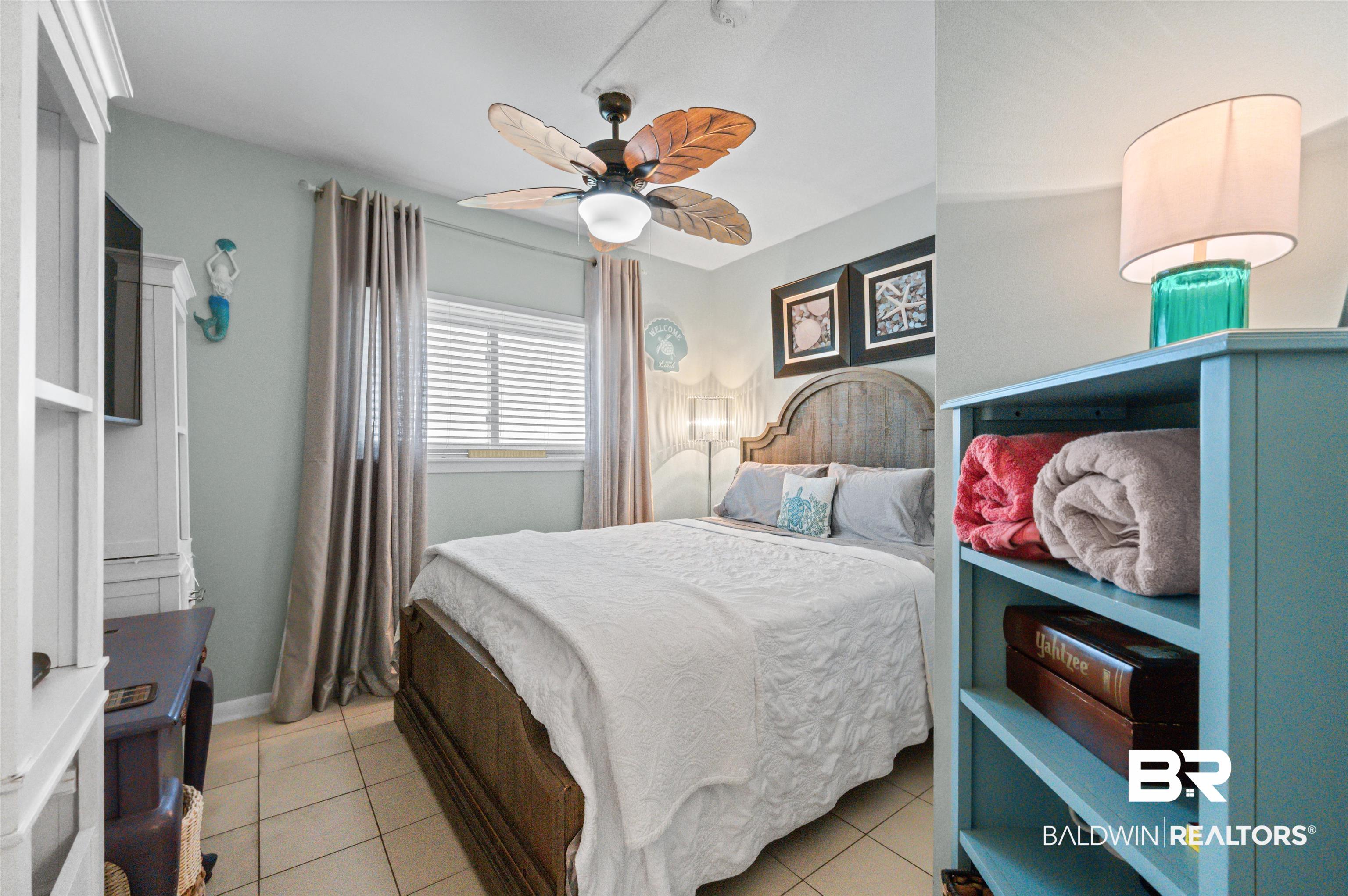 375 Plantation Road, Unit 5610 Gulf Shores, AL 36542 - Photo 11 of 33 Bedroom with light tile patterned floors and ceiling fan