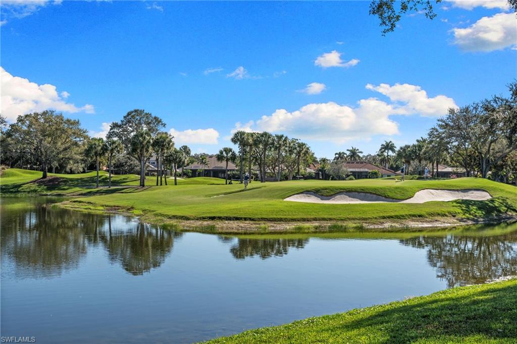 2421 Ravenna Boulevard, Unit 202 Naples, FL 34109 - Photo 23 of 42 a view of a lake with a big yard