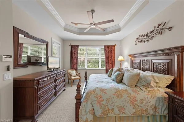a bedroom with a bed and a lamp