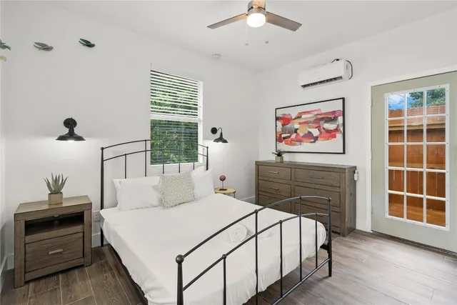 a bedroom with a bed and a window