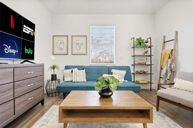 a living room with furniture and flat screen tv