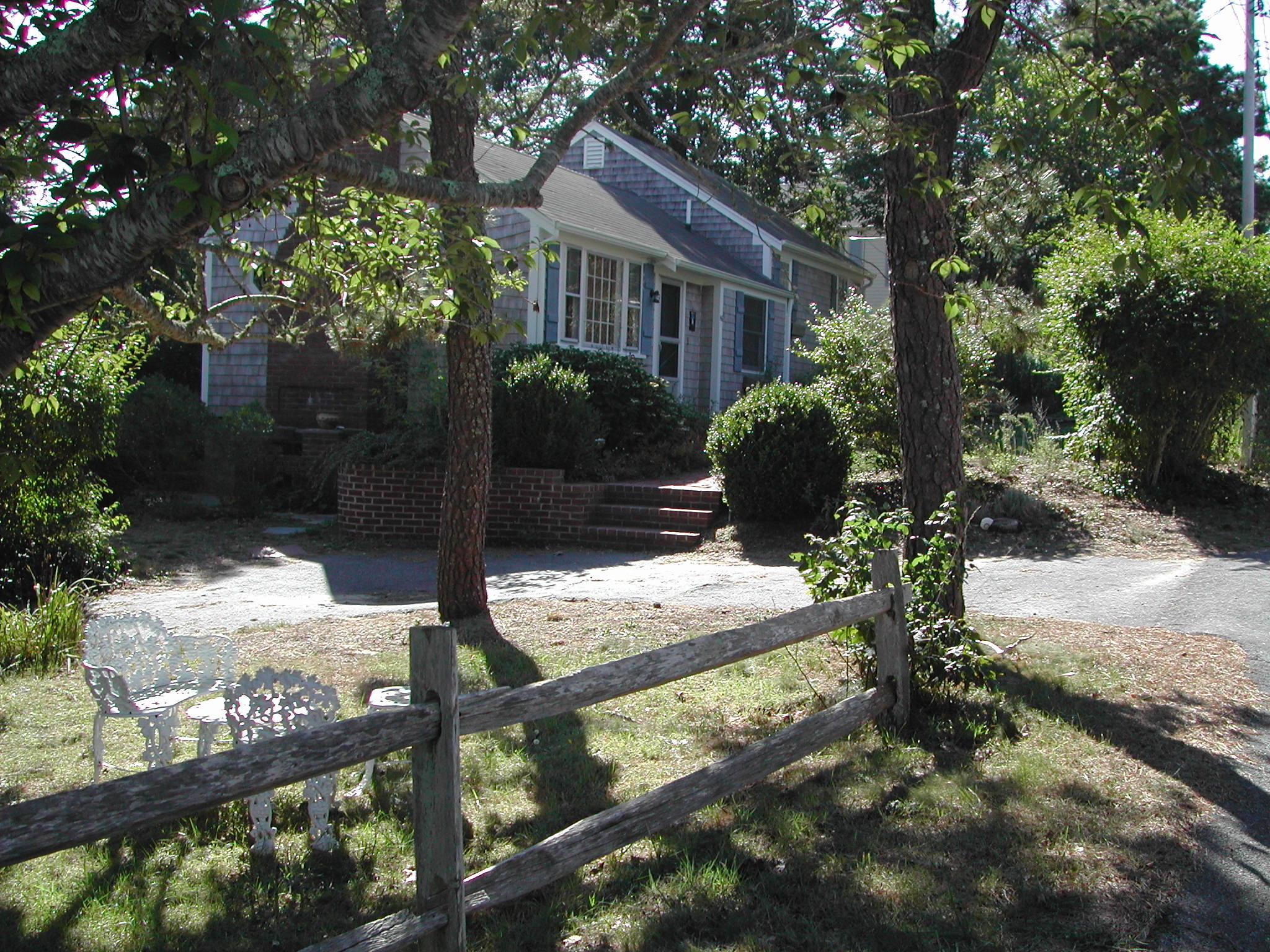 46 Tobey Turtle Road South Chatham, MA 02659 - Photo 11 of 11 a front view of a house with garden
