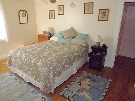 46 Tobey Turtle Road South Chatham, MA 02659 - Photo 3 of 11 a bed sitting in a bedroom and painting on the wall