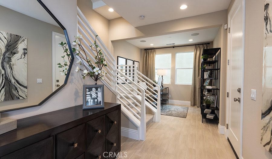 27356 Alpine Meadows Newhall, CA 91381 - Photo 2 of 11 a view of entryway with a window and stairs