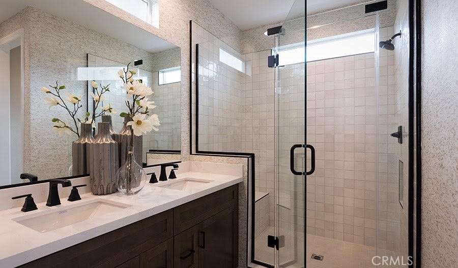 27356 Alpine Meadows Newhall, CA 91381 - Photo 5 of 11 a bathroom with a double vanity sink mirror and shower
