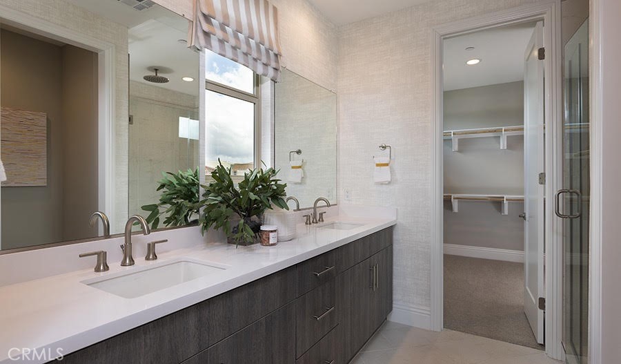 27356 Alpine Meadows Newhall, CA 91381 - Photo 7 of 11 a bathroom with a sink and a mirror
