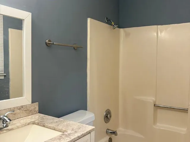 a bathroom with a toilet and a sink