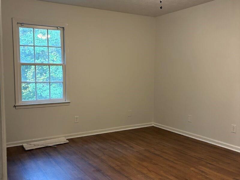 5510 Estates Court Norcross, GA 30093 - Photo 6 of 14 an empty room with wooden floor and windows