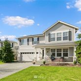 a front view of a house with garden and porch