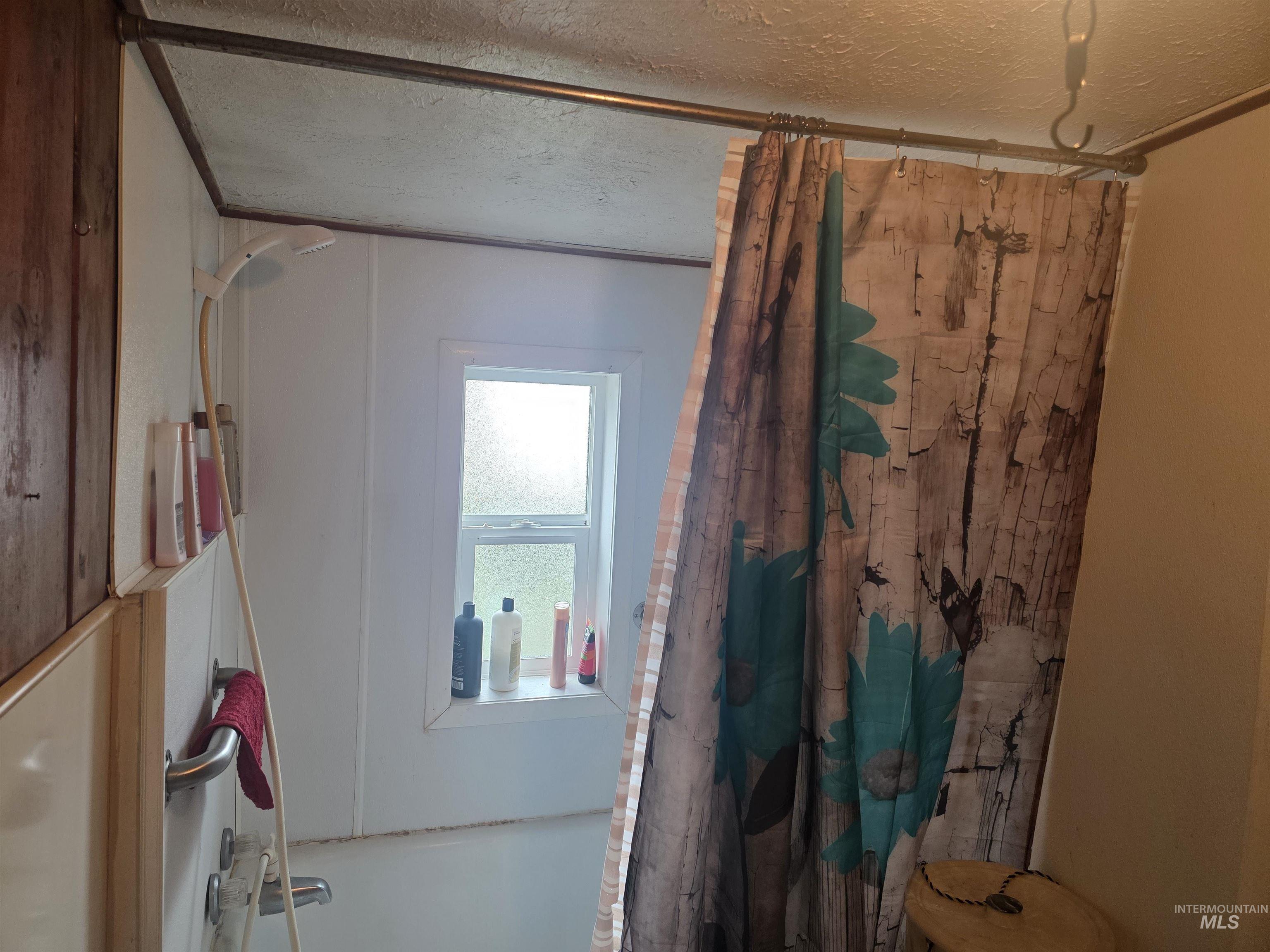 210 Pine Avenue Kooskia, ID 83539 - Photo 8 of 8 Misc room featuring a textured ceiling