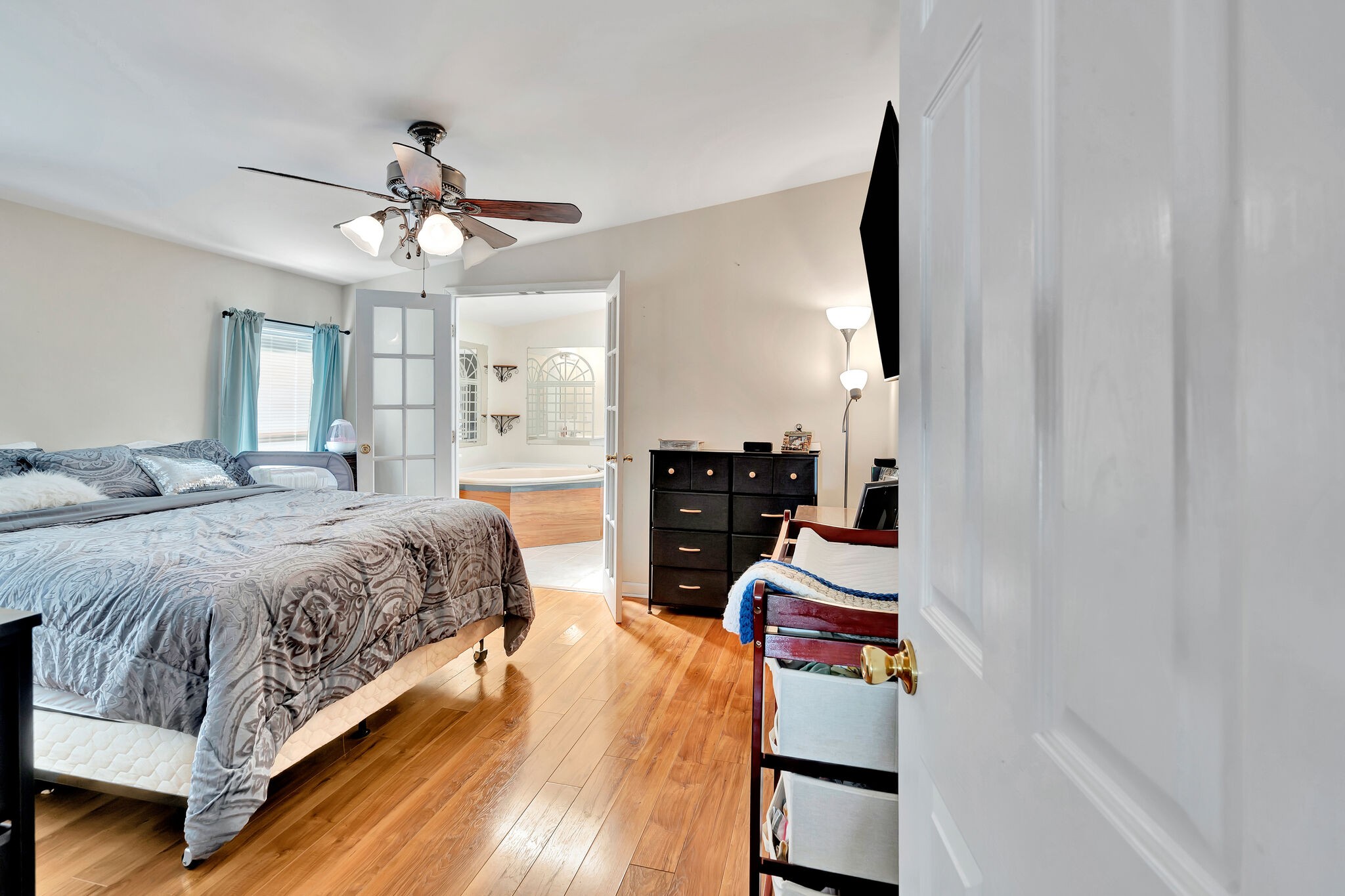 175 B Mitchell Road Portland, TN 37148 - Photo 11 of 29 a spacious bedroom with a bed and dresser with cabinet