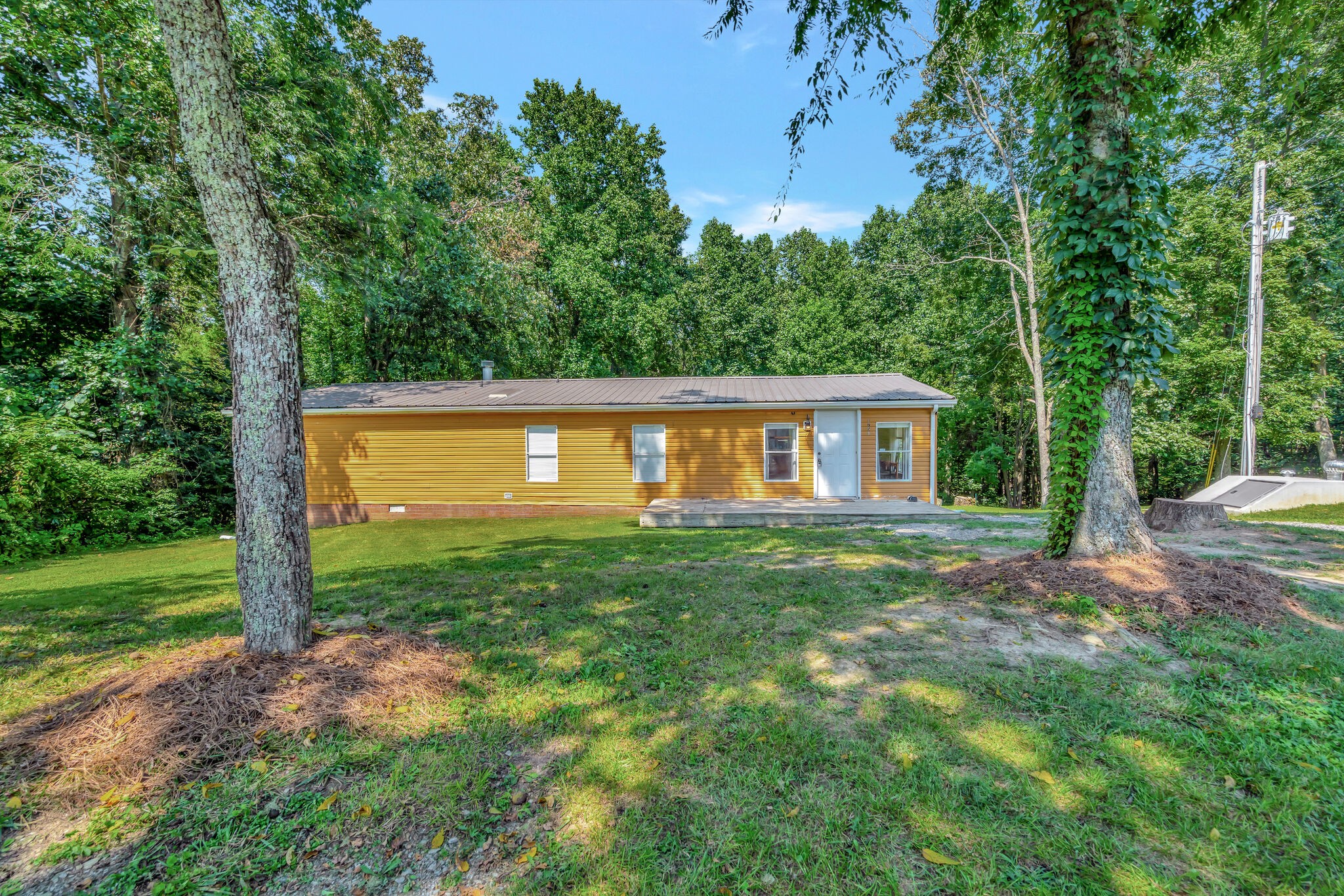 175 B Mitchell Road Portland, TN 37148 - Photo 2 of 29 a view of a house with backyard and garden