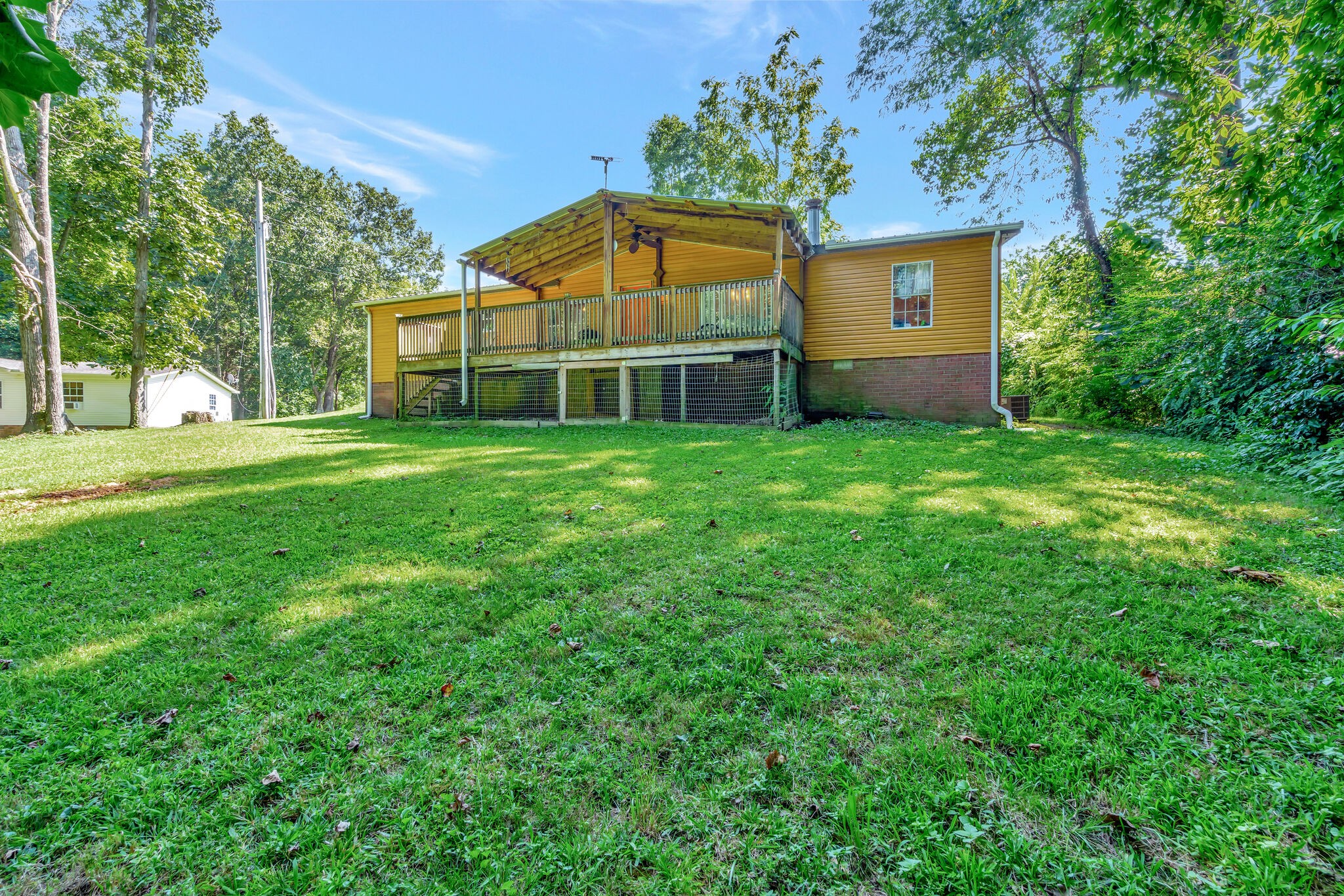 175 B Mitchell Road Portland, TN 37148 - Photo 28 of 29 a view of a backyard with a garden and plants