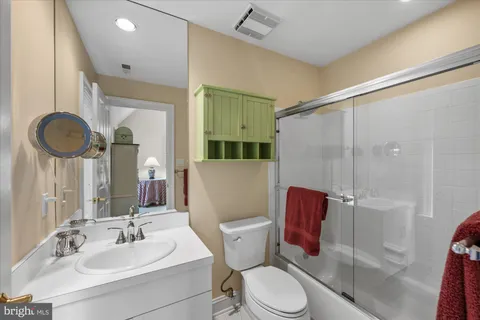 a bathroom with a toilet sink and shower