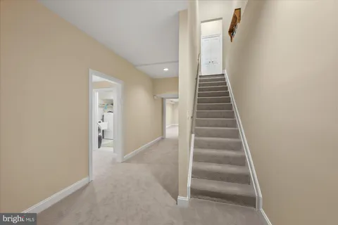 a view of a hallway view with staircase