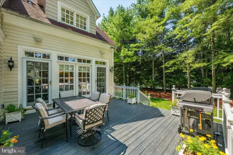 a backyard of a house with outdoor seating