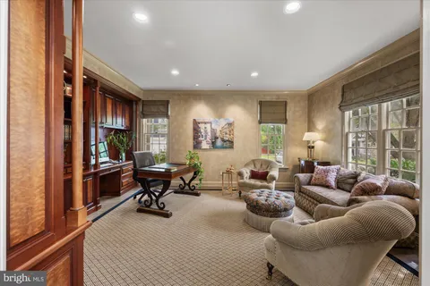 a living room with furniture window and a table