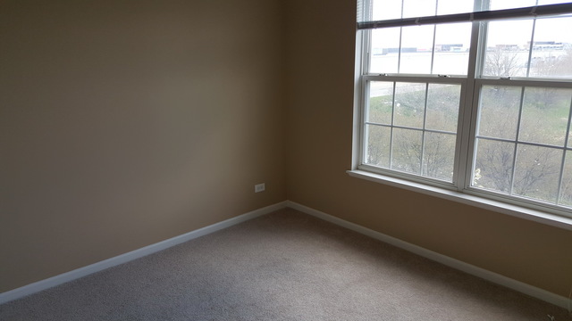 4205 Drexel Avenue Aurora, IL 60504 - Photo 10 of 16 a view of an empty room with a window