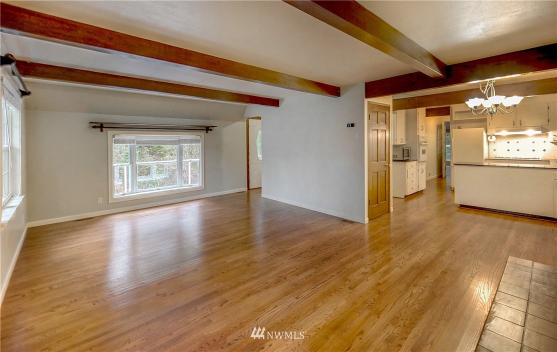 23200 19th Avenue Southeast Bothell, WA 98021 - Photo 22 of 40 a view of an empty room with window and wooden floor