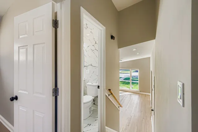 a bathroom with a sink toilet vanity and bathtub