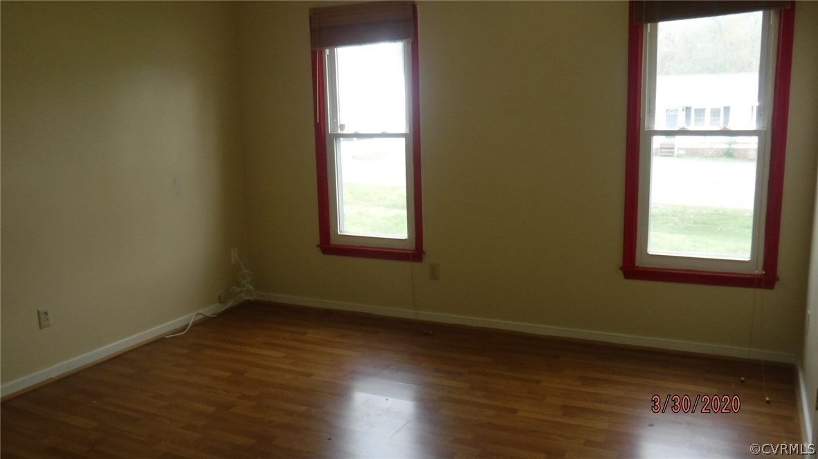 3022 Fielding Road Colonial Heights, VA 23834 - Photo 4 of 12 an empty room with wooden floor and windows