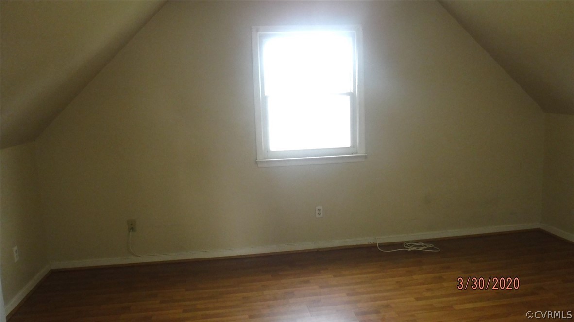 3022 Fielding Road Colonial Heights, VA 23834 - Photo 7 of 12 a view of an empty room with wooden floor and a window