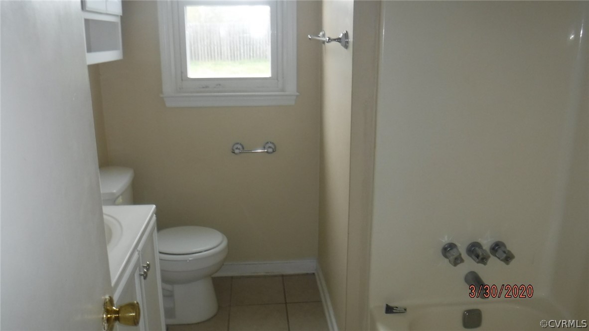 3022 Fielding Road Colonial Heights, VA 23834 - Photo 10 of 12 a white toilet sitting next to a bathroom sink