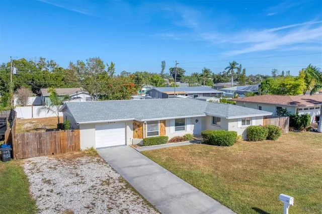 a aerial view of a house with a yard