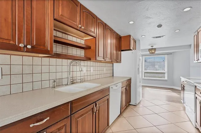 a kitchen with a sink and cabinets