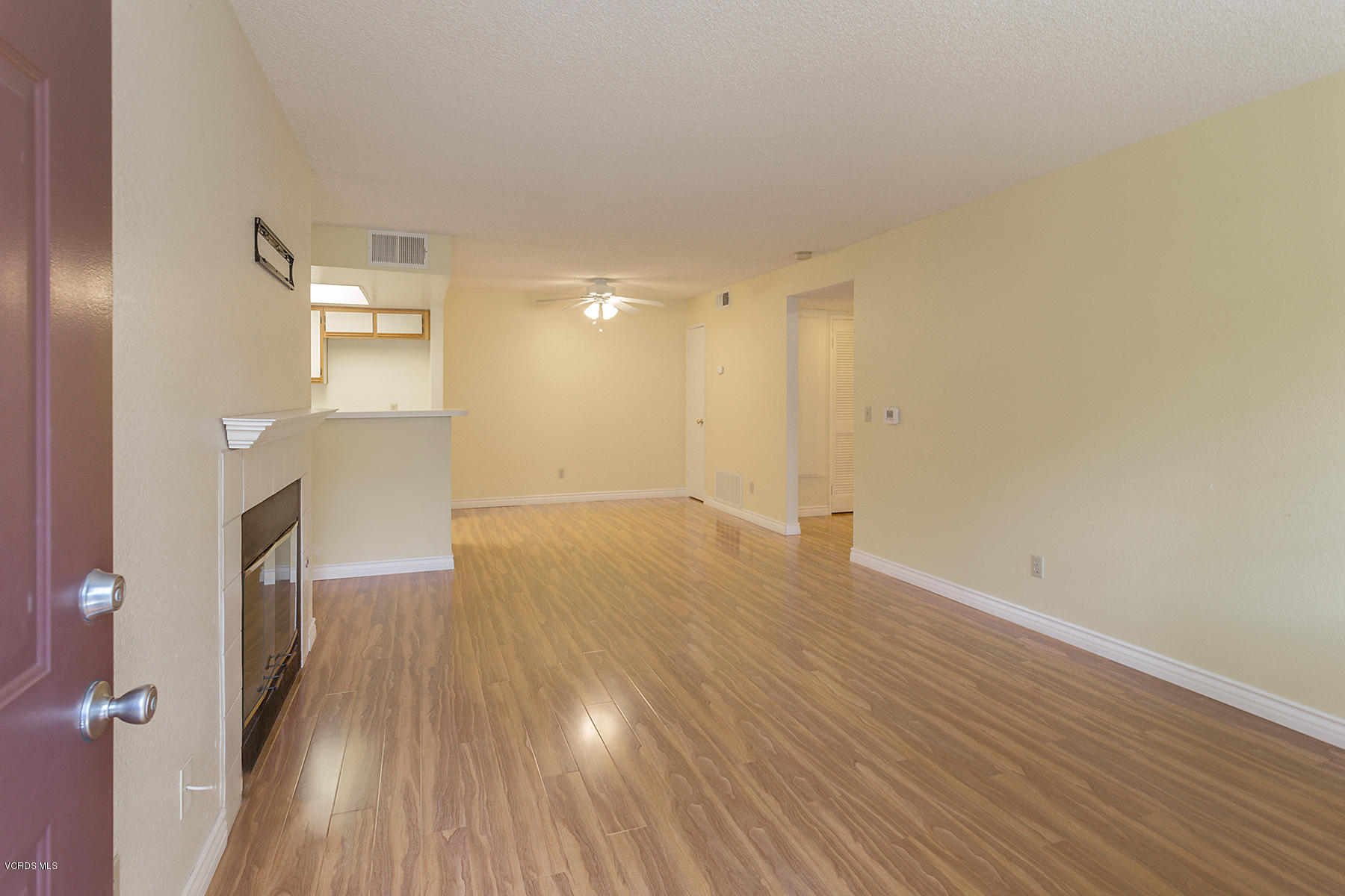 1195 Fitzgerald Road, Unit F Simi Valley, CA 93065 - Photo 3 of 18 a view of a livingroom with wooden floor