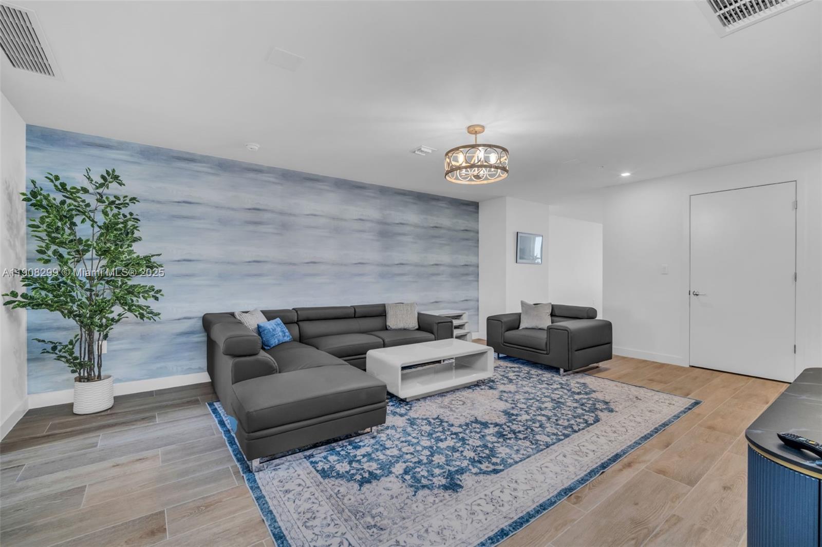 900 North Ocean Boulevard, Unit 503 Pompano Beach, FL 33062 - Photo 20 of 99 a living room with furniture and a potted plant