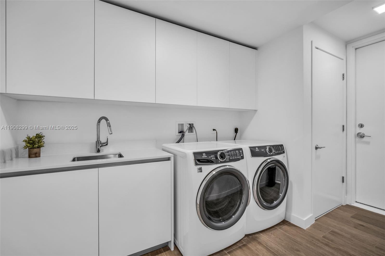 900 North Ocean Boulevard, Unit 503 Pompano Beach, FL 33062 - Photo 22 of 99 a utility room with sink dryer and washer